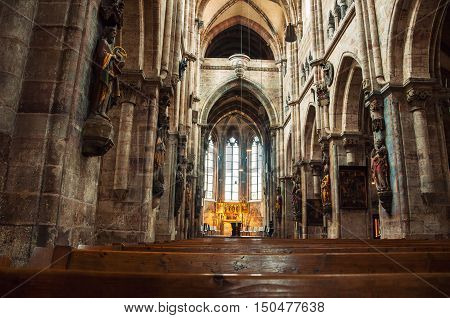 NUREMBERG GERMANY - MARCH 23 2014: Interior of St. Sebaldus medieval Church with a monument of St. Sebaldus. One of the most important and oldest churches of the city