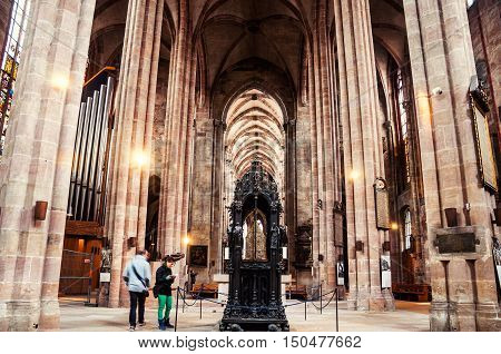 NUREMBERG GERMANY - MARCH 23 2014: Interior of St. Sebaldus medieval Church with a monument of St. Sebaldus. One of the most important and oldest churches of the city