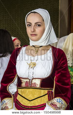 QUARTU S.E., ITALY - September 15, 2013: Wine Festival in honor of the celebration of St. Helena - Sardinia - portrait of a beautiful girl in traditional Sardinian costume