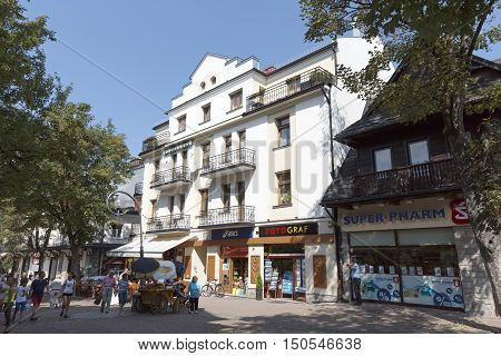 ZAKOPANE POLAND - SEPTEMBER 12 2016: Cukrow House brick house built in 1928 to 1929 that is located the main shopping area and pedestrian promenade in the downtown