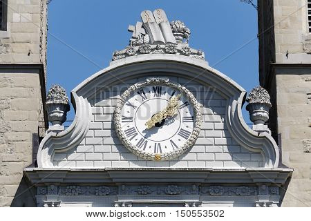LUCERNE SWITZERLAND - MAY 06 2016: The close up view of a clock that is placed above the main entrance and between the two towers of the Church of St. Leodegar that was built from 1633 to 1639.