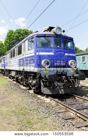 KOLOBRZEG POLAND - JUNE 23 2016: The electric locomotive EP07 series painted in white blue colors of PKP Intercity it is on the side track of the train station in the city