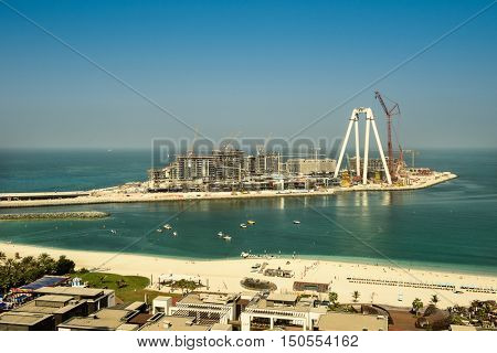 Dubai, UAE - OCTOBER 06, 2016: Bluewaters island construction in Dubai, UAE on October 06, 2016. Located off Jumeirah Beach Residence it will be the world's largest Ferris wheel, The Dubai Eye.
