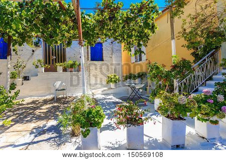 midday at traditional greek village house and patio