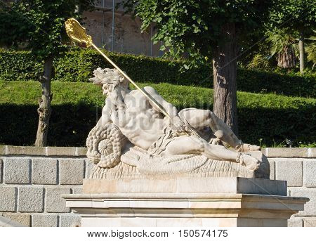 Statue of antique god on fountain in |Dobris castle