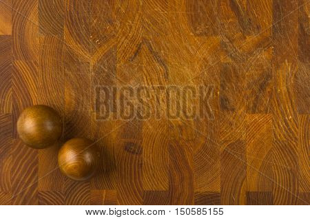 pair of wooden Chinese singing balls Baoding of health for hands on wooden background