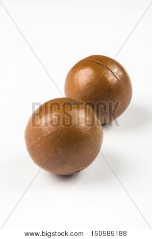 pair of copper Chinese singing balls Baoding of health for hands on white background