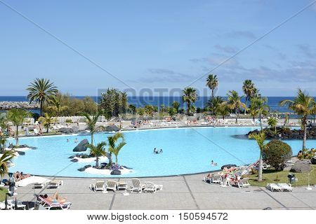 SANTA CRUZ, TENERIFE - APRIL 17, 2016: Outdoor swimming pool, Parque Maritimo Cesar Manrique in Santa Cruz de Tenerife, Spain.