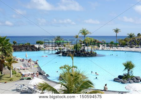 SANTA CRUZ, TENERIFE - APRIL 17, 2016: Outdoor swimming pool, Parque Maritimo Cesar Manrique in Santa Cruz de Tenerife, Spain.