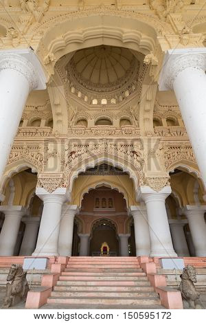 Madurai India - October 21 2013: Massive dome and extremely decorated ceiling over the throne at Nayak Palace. Stairs lead up to the audience hall.