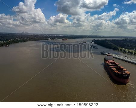 aerial view of muddy mississippi river shipping industry