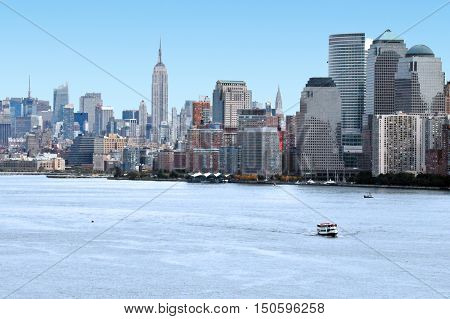 Manhattan skyline as view from the Hudson river with the Empire State Building in the background Manhattan New York.