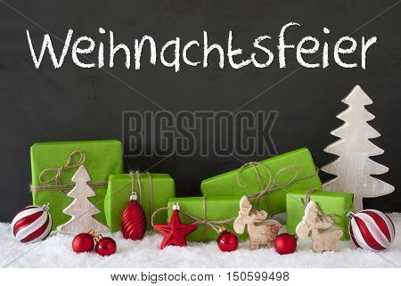 German Text Weihnachtsfeier Means Christmas Party. Green Gifts Or Presents With Christmas Decoration Like Tree, Moose Or Red Christmas Tree Ball. Black Cement Wall As Background With Snow.