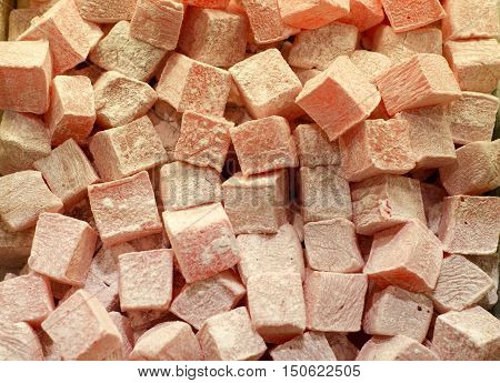 Pink pomegranate rose lokum in cube shape.