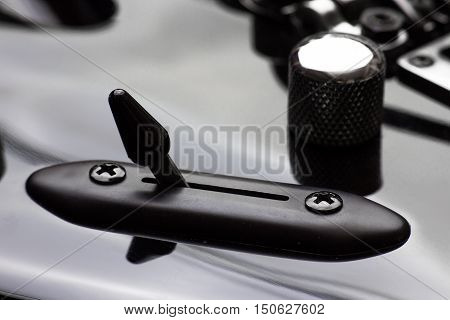 Electric guitar 5-way switch and knob close-up