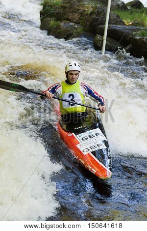 FRONGOCH WALES UNITED KINGDOM OCTOBER 5 2016: White water canoeist competing in the Canoe Wales National Slalom at the National White Water Centre on the River Tryweryn Frongoch North Wales