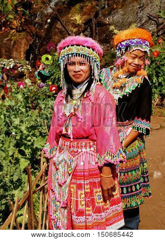 Doi Pui Thailand - December 24 2006: Two Thai women wearing vintage hilltop tribal village clothing with ornate headdresses