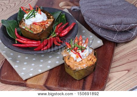 Streamed vegetable curry in banana leaf cup call "Hor Mok J" is spicy Thai organic food.