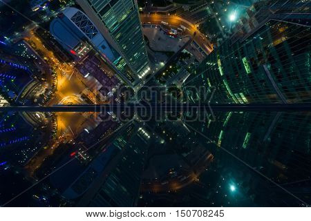 Skyscrapers with illumination in Shanghai city at night, top view from One Lujiazui building