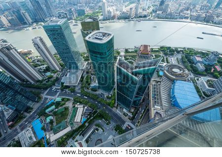 SHANGHAI - AUG 13, 2015: Top view of skyscrapers and river quay, view from IFC hotel, 990 skyscrapers are in Shanghai