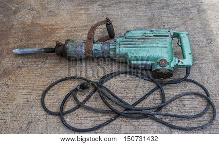Electric hammer Plugger. on the cement floor