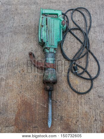Electric hammer Plugger. on the cement floor