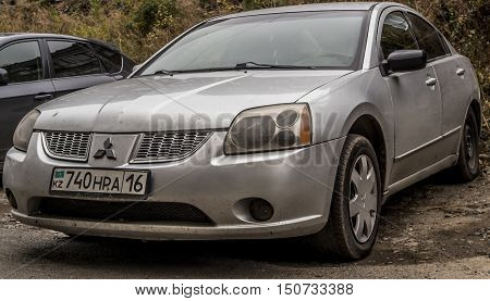 Kazakhstan, Ust-Kamenogorsk, october 5, 2016: Mitsubishi Galant, new car, japanese car in the street, sedan, gray