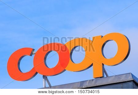 Zurich, Switzerland - 18 January, 2016: Coop sign on the top of a Coop department store building. Coop Cooperative is one of Switzerland's largest retail and wholesale companies, it is structured in the form of a cooperative society.
