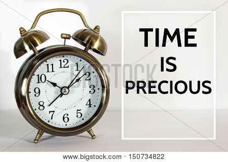 Text Time is precious on clock background / time concept