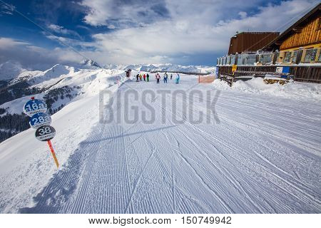 Kitzbuehel, Austria - February 17, 2016 - Skiers Skiing In Kitzbuehel Ski Resort And Enjoying Alps V