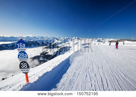 Kitzbuehel, February 18, 2016 - Skiers Skiing In Kitzbuehel Ski Resort And Enjoying Alps View From T