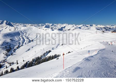View To Alpine Mountains And Ski Slopes In Austria From Kitzbuehel Ski Resort - One Of The Best Ski