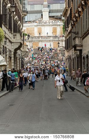 ROME ITALY - JUNE 15 2015: Spanish Steps and Via Condotti in Rome. This street is the center of fashion shopping in Rome with the atelier of Bulgari Armani Cartier Fendi Gucci  and others.