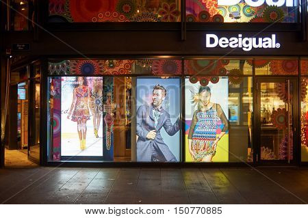 GENEVA, SWITZERLAND - NOVEMBER 18, 2015: a Desigual store at night. Desigual is a clothing brand headquartered in Barcelona, Spain.