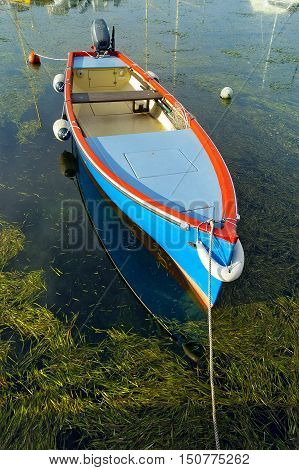 Typical small fishing boat moored in the port of Cisano Garda Lake (Lago di Garda) Bardolino Verona Veneto Italy Europe