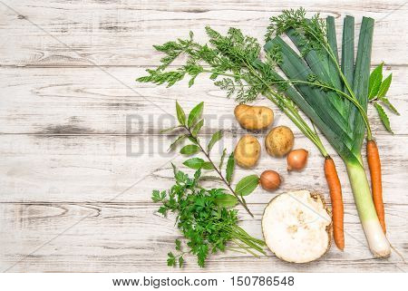 Fresh organic vegetables. Leek carrots onion parsley potatoes celery root bay laurel leaves. Healthy food