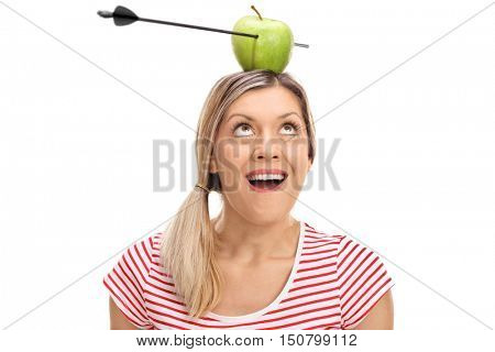 Overjoyed woman looking at an apple pierced by an arrow on her head isolated on white background