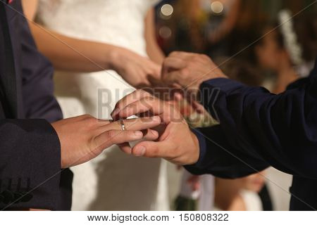 Bride And Groom Hands With Ring During Orthodox Church Wedding Ceremony