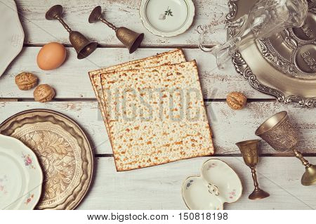 Passover background with matzoh on wooden table. View from above. Flat lay