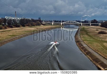 Motorboat and bridge over the river Warta Poznan