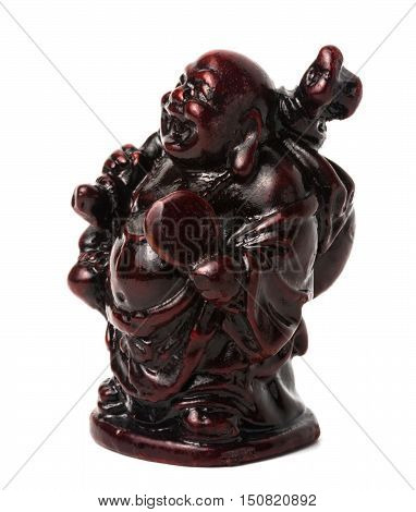 Netsuke happy fat man with a bag and a fan. Isolated. A miniature sculpture which was used as a button-like trinket in traditional Japanese clothes kimono kosode which was devoid of pockets.