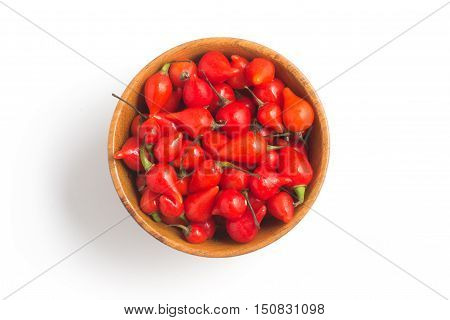 Biquinho Pepper into a bowl. Capsicum Chinense isolated in white background