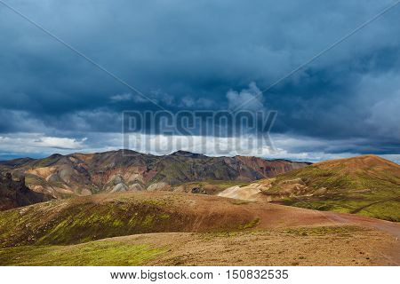 Valley National Park Landmannalaugar. On the gentle slopes of the mountains are snow fields and glaciers. Magnificent Iceland in the August