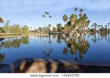 Bright blue winter sky on the lake in Encanto park located right in downtown of Phoenix Arizona; Copyspace