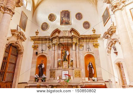 GUANAJUATO, MEXICO - DECEMBER 30, 2014 Jesus Monk Priest Nun Statues Basilica Templo De La Compania Christmas Guanajuato Mexico. Built by the Jesuits between 1746 to 1765.