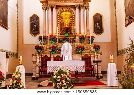 GUANAJUATO, MEXICO - DECEMBER 30, 2014 Basilica Templo De La Compania Christmas Poinsettias Guanajuato Mexico. Built by the Jesuits between 1746 to 1765.