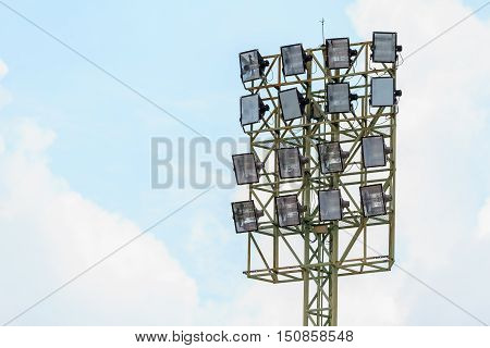 Sport stadium floodlights on a cloudy background. Soccer stadium lighting.