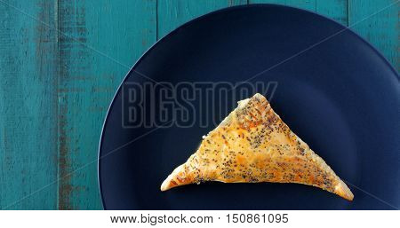 Flat Lay Of One Triangular Burekasin Served On A Plate