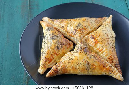 Above View Of Four Triangular Burekasin Served On A Plat