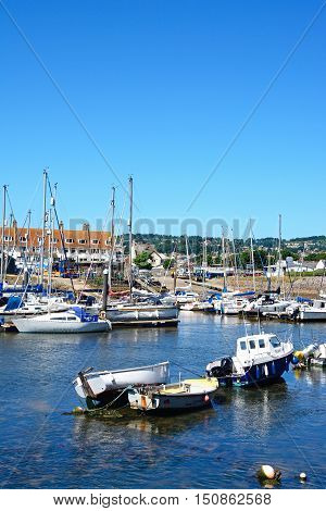 AXMOUTH, UNITED KINGDOM - JULY 18, 2016 - Yachts and fishing boats moored in the harbour Axmouth Devon England UK Western Europe, July 18, 2016.